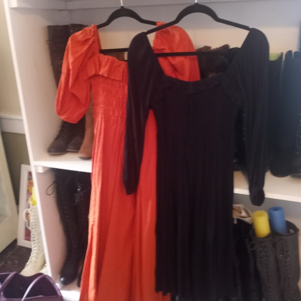 Two Peasant style dresses with tags still attached.